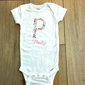 NEW- baby girl onesie with the name Paisley. Size 3-6 months